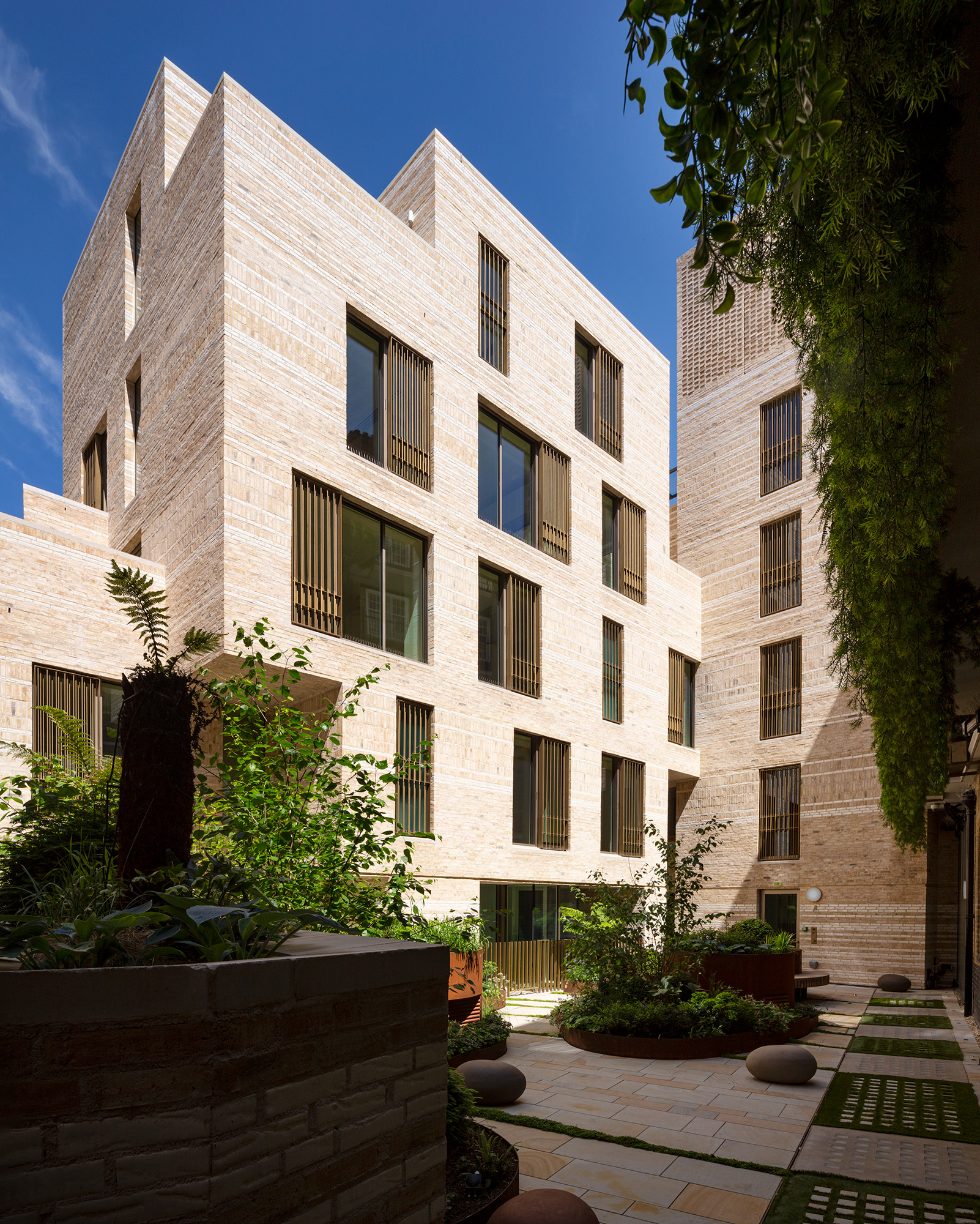 Corner courtyard view of new apartment building